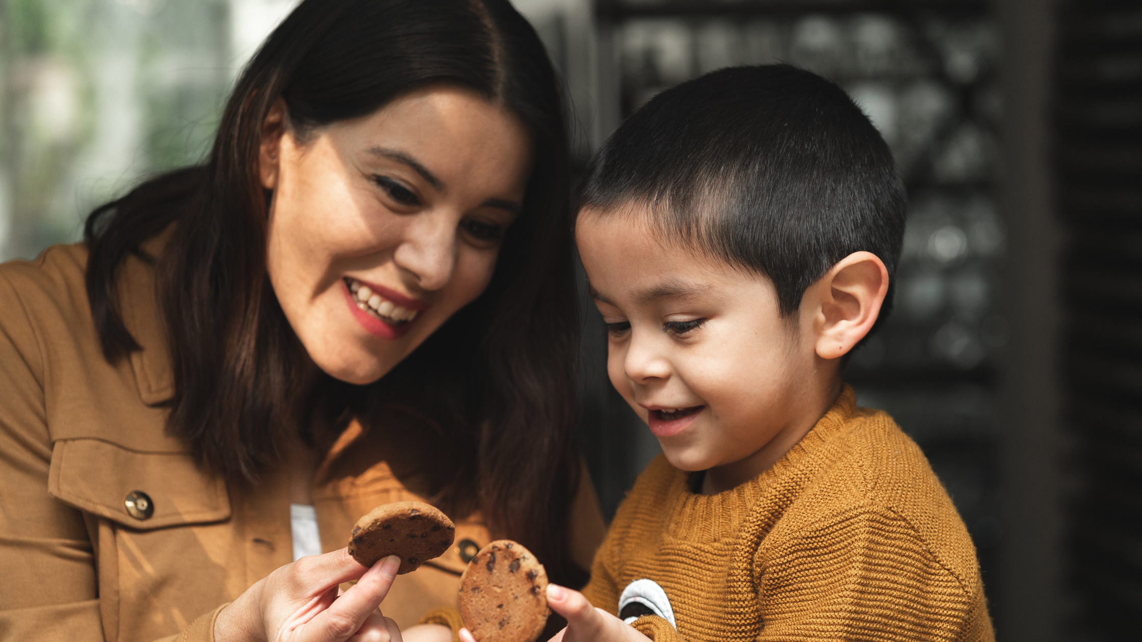 good mom with her son eating cookies